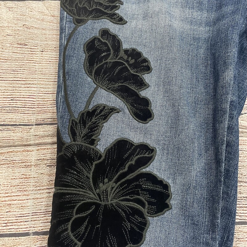 Chicos straight legs jeans wide waist band inside. For more comfort . This has embrodidery velvet flowers on both legs. Size 0/Small