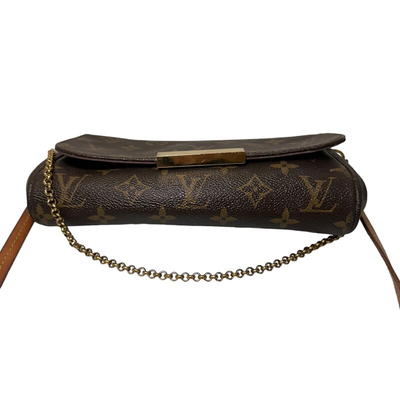 Louis Vuitton Favorite, Monogram, Size: PM<br />
LOUIS VUITTON Monogram  Favorite PM. This stylish clutch is crafted of durable Louis Vuittoncoated canvas in brown. The bag features a short polished gold-toned chain strap, and a removable brown leather crossbody strap. The flap opens with a magnetic gold bar to a red canvas lining with a patch pocket.<br />
<br />
Dimensions:<br />
Base length: 8.5 in<br />
Height: 5.5 in<br />
Width: 2 in<br />
Drop: 7.5 in<br />
Drop: 21 in<br />
<br />
Date Code: SD2157<br />
<br />
Note:  Some sctraches on hardware