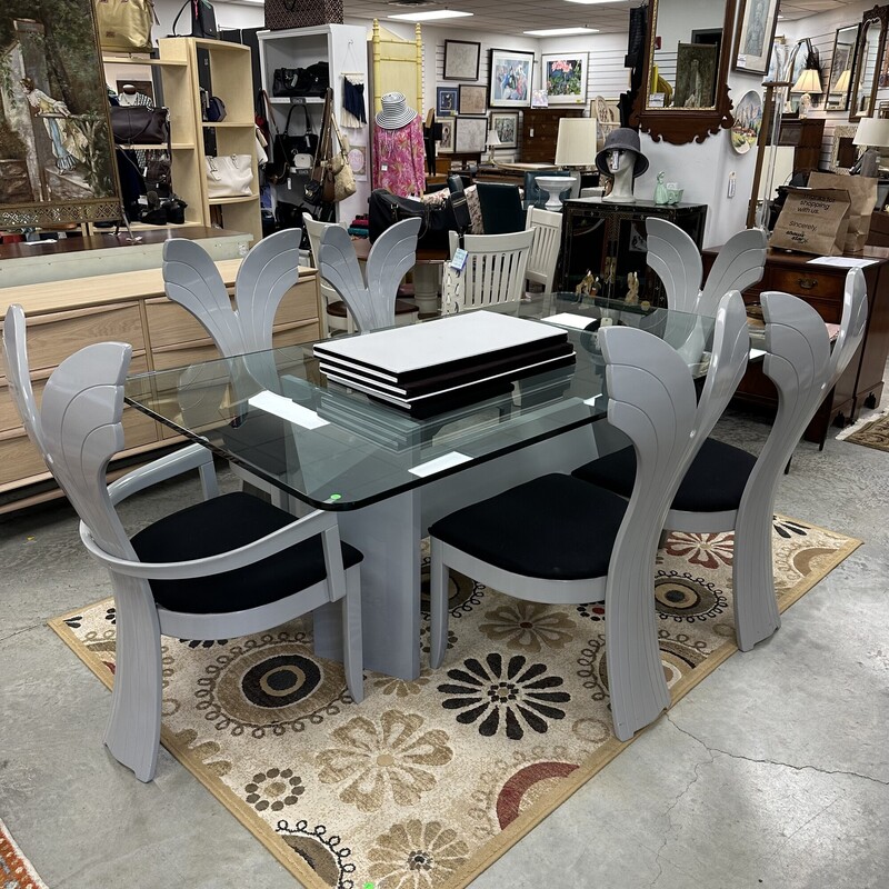 Beautiful Art Deco Dining Room Set, in excellent condition and appears to have been rarely used. The glass-top dining table measures 79x42in and the heavy glass is about an inch thick. Includes six upholstered shell-back chairs, also in great condition. Set is in a slate gray finish, and table pads are included.