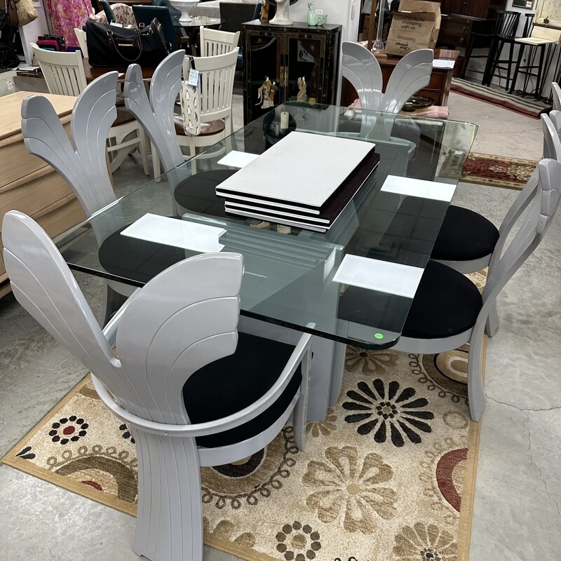 Beautiful Art Deco Dining Room Set, in excellent condition and appears to have been rarely used. The glass-top dining table measures 79x42in and the heavy glass is about an inch thick. Includes six upholstered shell-back chairs, also in great condition. Set is in a slate gray finish, and table pads are included.