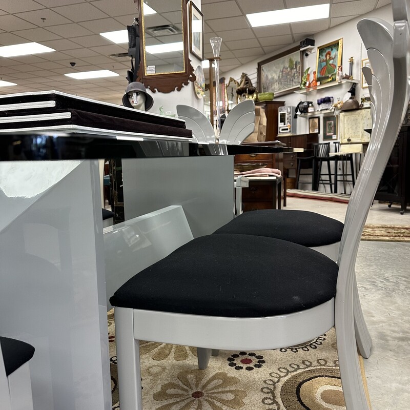 Beautiful Art Deco Dining Room Set, in excellent condition and appears to have been rarely used. The glass-top dining table measures 79x42in and the heavy glass is about an inch thick. Includes six upholstered shell-back chairs, also in great condition. Set is in a slate gray finish, and table pads are included.