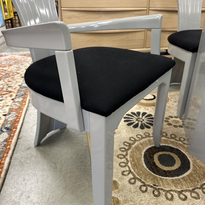 Beautiful Art Deco Dining Room Set, in excellent condition and appears to have been rarely used. The glass-top dining table measures 79x42in and the heavy glass is about an inch thick. Includes six upholstered shell-back chairs, also in great condition. Set is in a slate gray finish, and table pads are included.