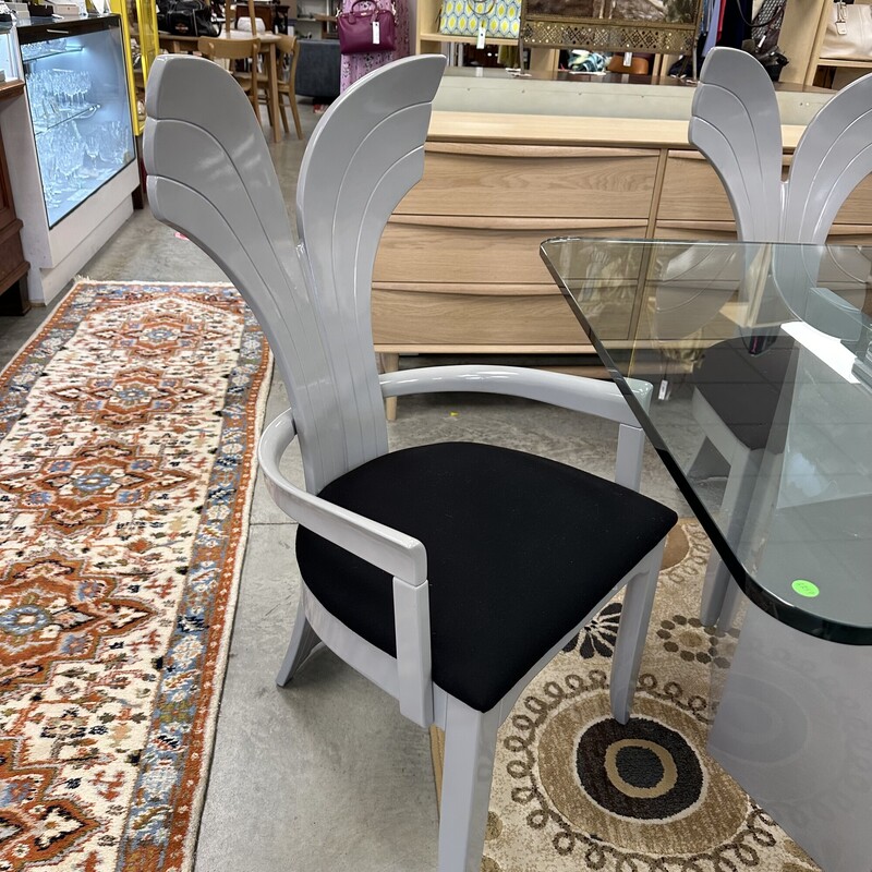 Beautiful Art Deco Dining Room Set, in excellent condition and appears to have been rarely used. The glass-top dining table measures 79x42in and the heavy glass is about an inch thick. Includes six upholstered shell-back chairs, also in great condition. Set is in a slate gray finish, and table pads are included.