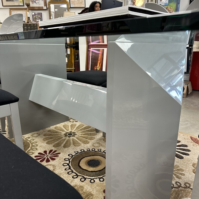 Beautiful Art Deco Dining Room Set, in excellent condition and appears to have been rarely used. The glass-top dining table measures 79x42in and the heavy glass is about an inch thick. Includes six upholstered shell-back chairs, also in great condition. Set is in a slate gray finish, and table pads are included.