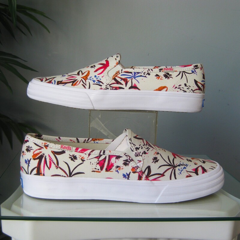 Cute slip on keds in Island Print<br />
Pink and gray on white base<br />
brand new in box.<br />
size 9<br />
thanks for looking!<br />
#76589