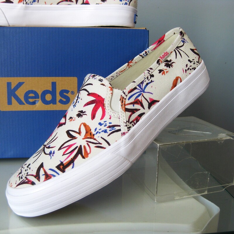 Cute slip on keds in Island Print<br />
Pink and gray on white base<br />
brand new in box.<br />
size 9<br />
thanks for looking!<br />
#76589