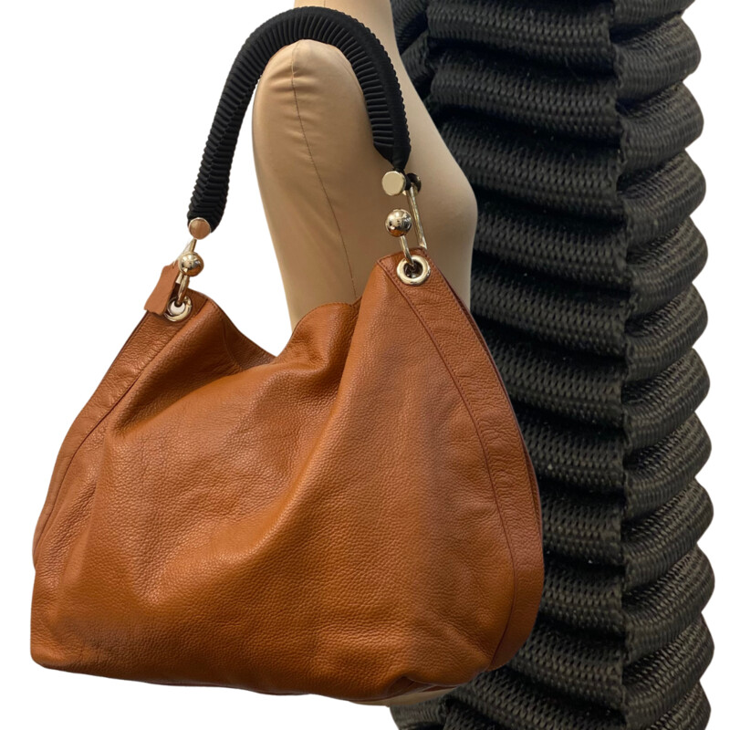 Marni Leather Bag<br />
Designer Label<br />
Super Soft Leather<br />
Black Woven Handle<br />
Artistic Gold Hardware<br />
Color:  Cognac