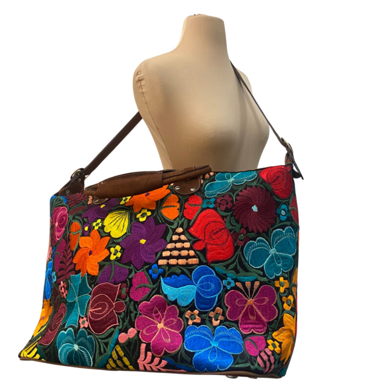 Guatemalan Embroidered Floral Tote<br />
Gorgeous Colors!<br />
Handles and Crossbody Strap<br />
Zipper Closure<br />
Large Front Zipper Pocket<br />
Perfect for the Next Trip!