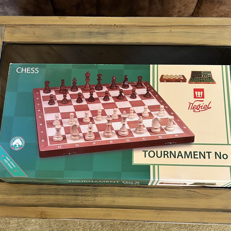 Negiel Chess Set,
 Size: 21 X 21
Brand new in the box... A tournament regulation size chaess set made in Poland.  The board is made from sycamore and measures 21 x 21; each square is 2 1/4 sq.  The pieces are weighted and felted. The board folds in halfand the peices can be stored inside in felted sections.  Great for a beginner or an experienced player.