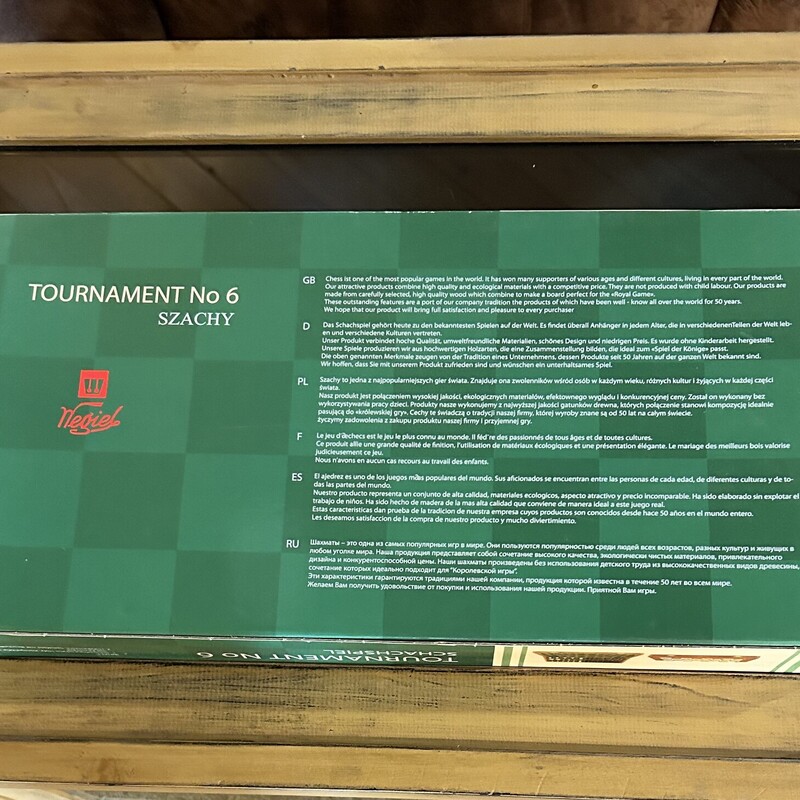 Negiel Chess Set,
 Size: 21 X 21
Brand new in the box... A tournament regulation size chaess set made in Poland.  The board is made from sycamore and measures 21 x 21; each square is 2 1/4 sq.  The pieces are weighted and felted. The board folds in halfand the peices can be stored inside in felted sections.  Great for a beginner or an experienced player.