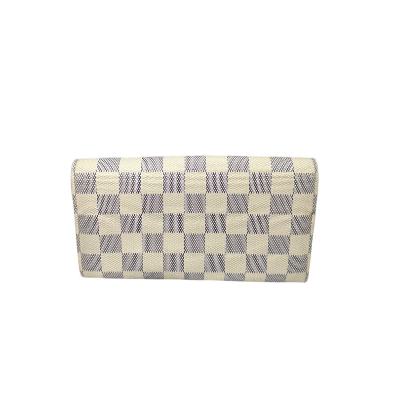 Louis Vuitton Sarah, Damier<br />
Dimensions: 7.5 x 3.9 inches<br />
(length x Height)<br />
Damier Azur coated canvas<br />
Grained cowhide-leather lining<br />
Gold-color hardware<br />
Press-stud closure<br />
2 large gusseted compartments<br />
Zipped coin pocket<br />
Inside flat pocket<br />
Outside flat pocket<br />
16 card slots