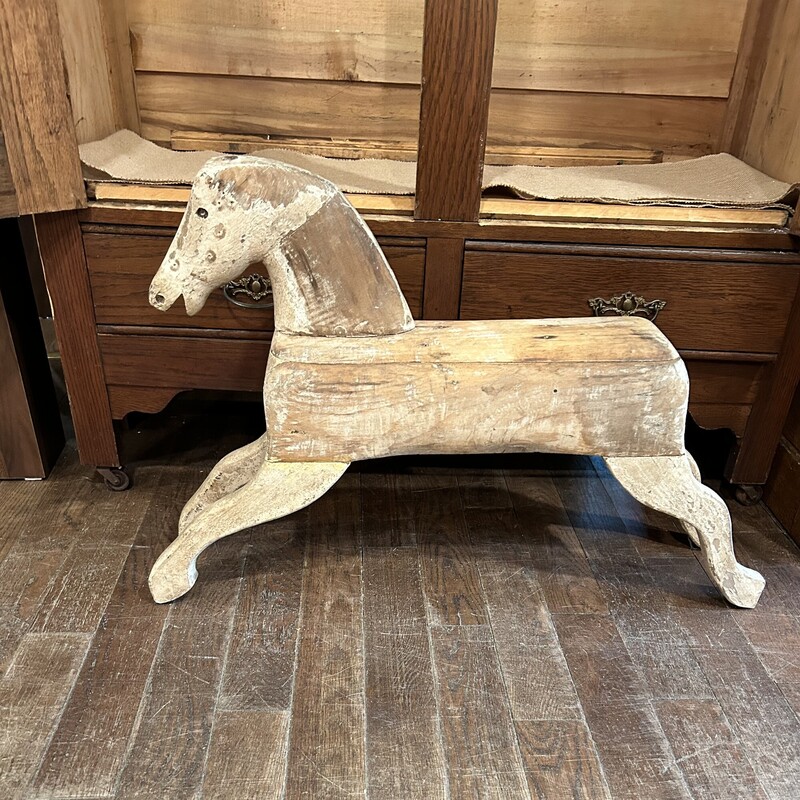 Antique Rocking Horse,
Size: 32x7x22
This is an authentic rocking horse without the rockers which makes it easier to display.  This is a great example of american folk art.