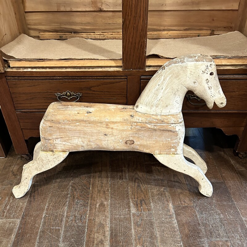 Antique Rocking Horse,
Size: 32x7x22
This is an authentic rocking horse without the rockers which makes it easier to display.  This is a great example of american folk art.