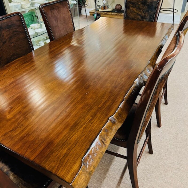 Century Furniture Live Edge Table and  6 Theo Alexander Sweep Cowhide Chairs<br />
<br />
Browns Black Silver Accent Base<br />
Table Size: 80 x 40 x 30H<br />
6 Armless Cowhide Chairs Size: 20 x 24 x 42H<br />
Seat Height: 20H<br />
Retail $19,000 New