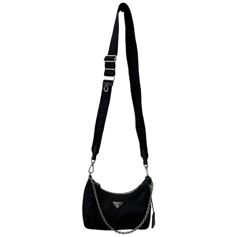 Prada Re Edition Nylon 2005 Black Crossbody<br />
<br />
Dimensions:<br />
Height: 18cm<br />
Width: 22cm<br />
Length: 6cm<br />
<br />
Factory Code: 7/D<br />
<br />
Note: small rip on inteior by the tag, does not come with small pouch.