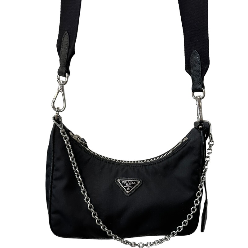 Prada Re Edition Nylon 2005 Black Crossbody<br />
<br />
Dimensions:<br />
Height: 18cm<br />
Width: 22cm<br />
Length: 6cm<br />
<br />
Factory Code: 7/D<br />
<br />
Note: small rip on inteior by the tag, does not come with small pouch.