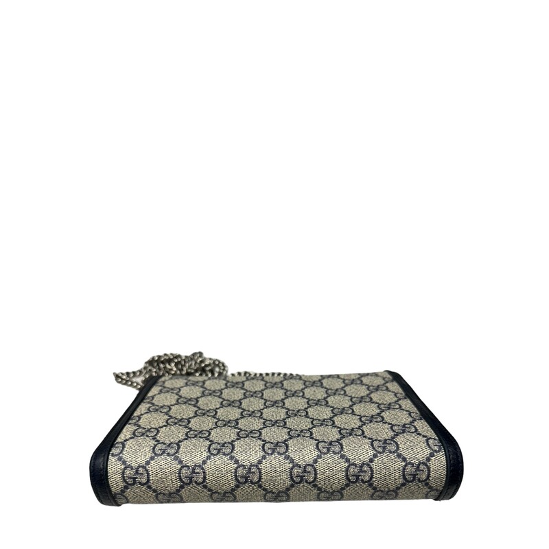 Gucci Dionysus WOC, Navy, Size: Mini
Mirroring the material's historic origins, GG Supreme is introduced in a timeless mix of blue and beige for Gucci Love Parade. The canvas has come to the front of each collection decade after decade to become a hallmark of the House. Here, the classic palette defines this Dionysus chain wallet.

Beige and blue GG Supreme canvas
Blue leather trim
Tiger head spur
Hand-painted edges
Hand-stitched details
16 card slots and two bill compartments
Three separate interior compartments
Zip coin pocket
Chain shoulder strap with 60cm drop
Snap closure
8W x 5H x 2.3D
Made in Italy
Style Code: 401231 2067