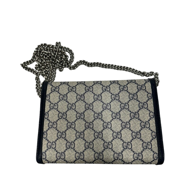 Gucci Dionysus WOC, Navy, Size: Mini<br />
Mirroring the material's historic origins, GG Supreme is introduced in a timeless mix of blue and beige for Gucci Love Parade. The canvas has come to the front of each collection decade after decade to become a hallmark of the House. Here, the classic palette defines this Dionysus chain wallet.<br />
<br />
Beige and blue GG Supreme canvas<br />
Blue leather trim<br />
Tiger head spur<br />
Hand-painted edges<br />
Hand-stitched details<br />
16 card slots and two bill compartments<br />
Three separate interior compartments<br />
Zip coin pocket<br />
Chain shoulder strap with 60cm drop<br />
Snap closure<br />
8W x 5H x 2.3D<br />
Made in Italy<br />
Style Code: 401231 2067