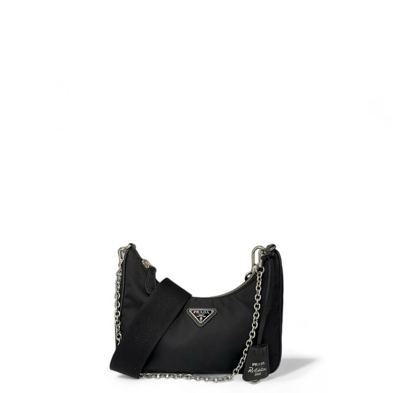 Prada Re Edition Nylon 2005 Black Crossbody

Dimensions:
Height: 18cm
Width: 22cm
Length: 6cm

Factory Code: 7/D

Note: small rip on inteior by the tag, does not come with small pouch.