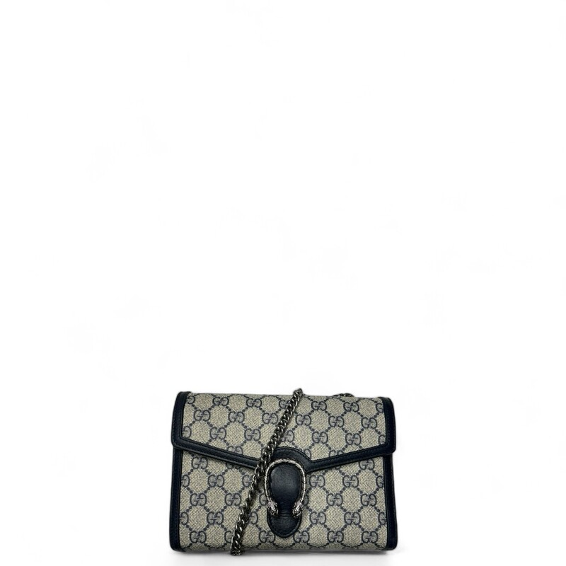 Gucci Dionysus WOC, Navy, Size: Mini
Mirroring the material's historic origins, GG Supreme is introduced in a timeless mix of blue and beige for Gucci Love Parade. The canvas has come to the front of each collection decade after decade to become a hallmark of the House. Here, the classic palette defines this Dionysus chain wallet.

Beige and blue GG Supreme canvas
Blue leather trim
Tiger head spur
Hand-painted edges
Hand-stitched details
16 card slots and two bill compartments
Three separate interior compartments
Zip coin pocket
Chain shoulder strap with 60cm drop
Snap closure
8W x 5H x 2.3D
Made in Italy
Style Code: 401231 2067