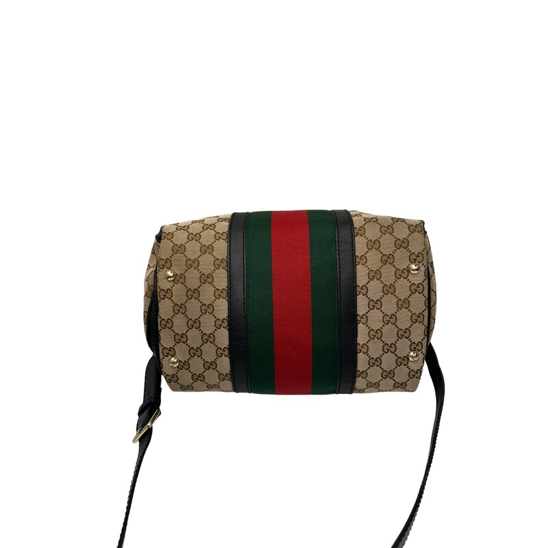 GUCCI Monogram Vintage Web Medium Boston in Dark Brown. This chic vintage style tote is finely crafted of Gucci GG monogram canvas, with a red and green web stripe detail at the center. The bag features rolled top handles, an optional shoulder strap, trim and light brass hardware. The top zipper opens the bag to a natural fiber interior with zipper and patch pockets.<br />
<br />
* Interior and coner wear<br />
Base length: 12.25 in<br />
Height: 8.50 in<br />
Width: 7.00 in<br />
Drop: 4.00 in<br />
Drop: 18.50 in<br />
<br />
Style Code: 247205