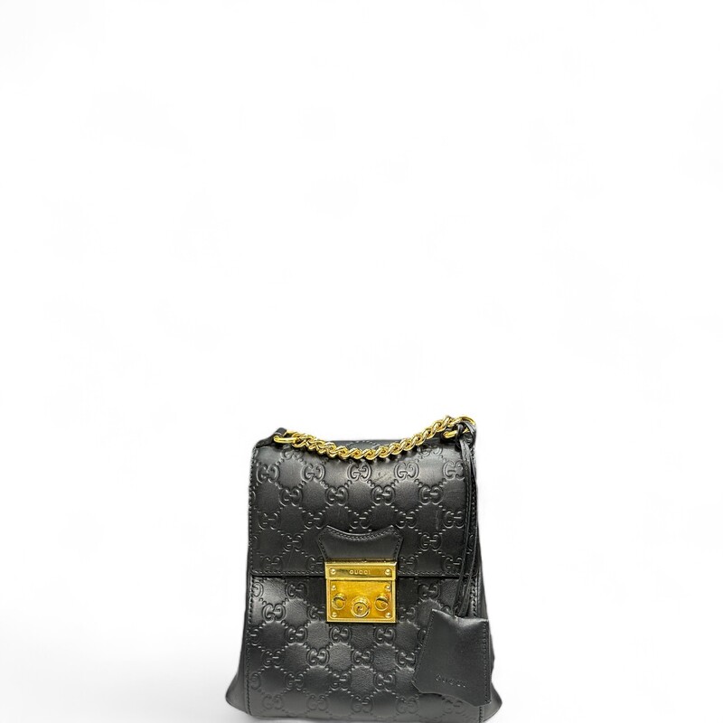 GUCCI Guccissima Signature Padlock Backpack in Black. This stylish tote is crafted of Gucci GG monogram calfskin leather in black. The shoulder bag features gold-tone hardware, adjustable black leather shoulder straps, and opens to a rose beige suede interior with patch pockets.

Dimensions:
Base length: 8.25 in
Height: 8 in
Width: 3.5 in
Drop: 2 in
Drop: 12.5 in

Style Code:498194

Some marks on hardware