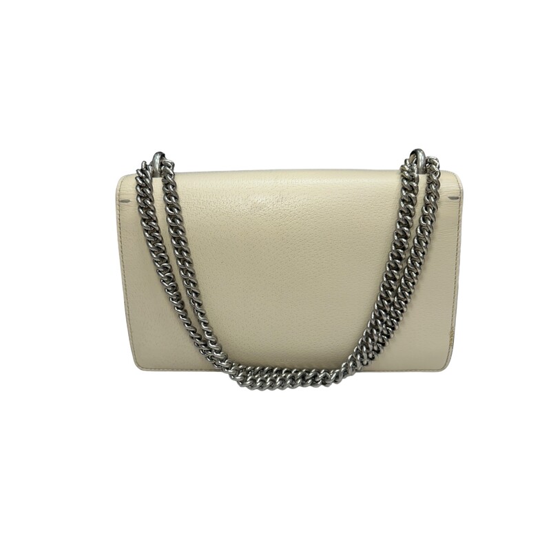 GUCCI Textured Calfskin Crystal Small Dionysus Shoulder Bag in Mystic White. This stylish bag is crafted of textured calfskin leather in white. This shoulder bag features an aged silver chain shoulder strap, and a textured horseshoe closure with lion heads at the end. This opens to a beige fabric interior with a central zipper pocket.<br />
<br />
* Some Sratches on the leather and interior wear and stains.<br />
<br />
Dimensions:<br />
Base length: 10.75 in<br />
Height: 6.75 in<br />
Width: 3.75 in<br />
Drop: 9.00 in<br />
Drop: 15.00 in<br />
<br />
Style Code: 400429