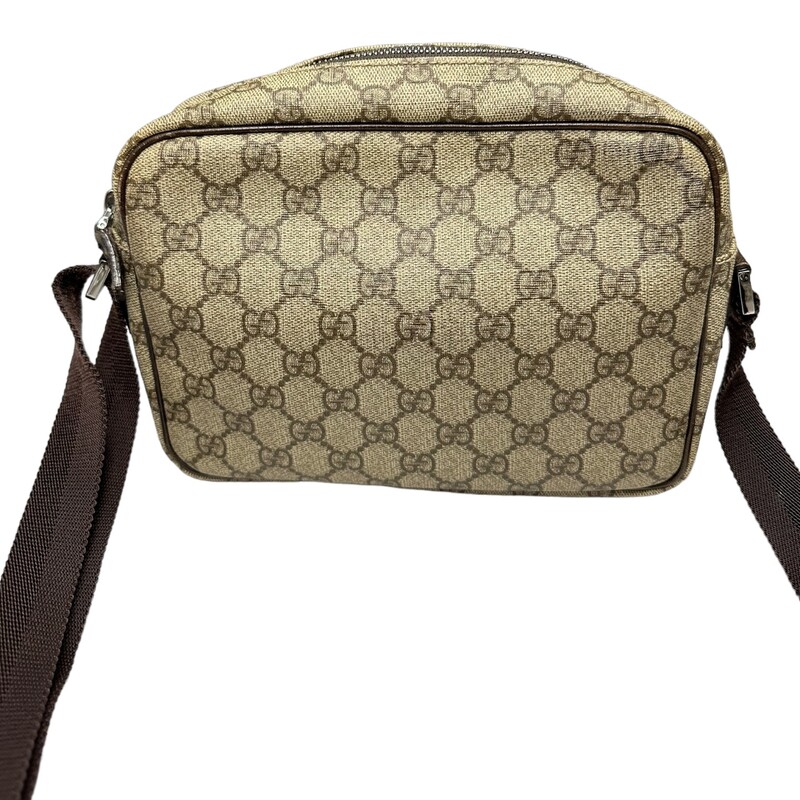 Gucci GG Supreme Front Pocket Crossbody<br />
<br />
Style Code: 114291 002055<br />
<br />
Dimensions:<br />
Base length: 9.50 in<br />
Height: 7.00 in<br />
Width: 2.50 in<br />
Drop: 12.25 in to 0.00 in<br />
<br />
Dust bag included<br />
<br />
Note: Light wear on brown leather trim, sides and top leather by pocket.