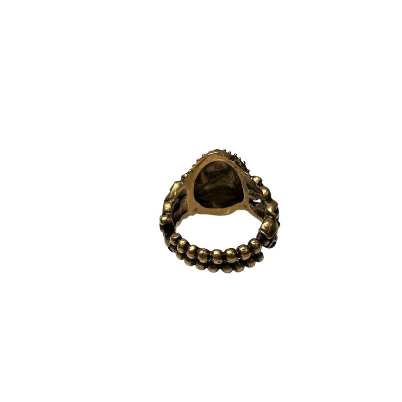 Gucci Monkey Head Ring Coonstructed from aged gold metal and features a monkey head at the front with red crystals as the eyes<br />
Measurements: Band Width 9.9mm, Ornament Width 17mm, Ornament Length 21.8mm<br />
Metal Type: Gold-Tone Metal<br />
Marks: Designer Signature<br />
Metal Finish: High Polish, Antiqued<br />
Total Item Weight (g): 12.1<br />
Non-Gem Materials: Crystal