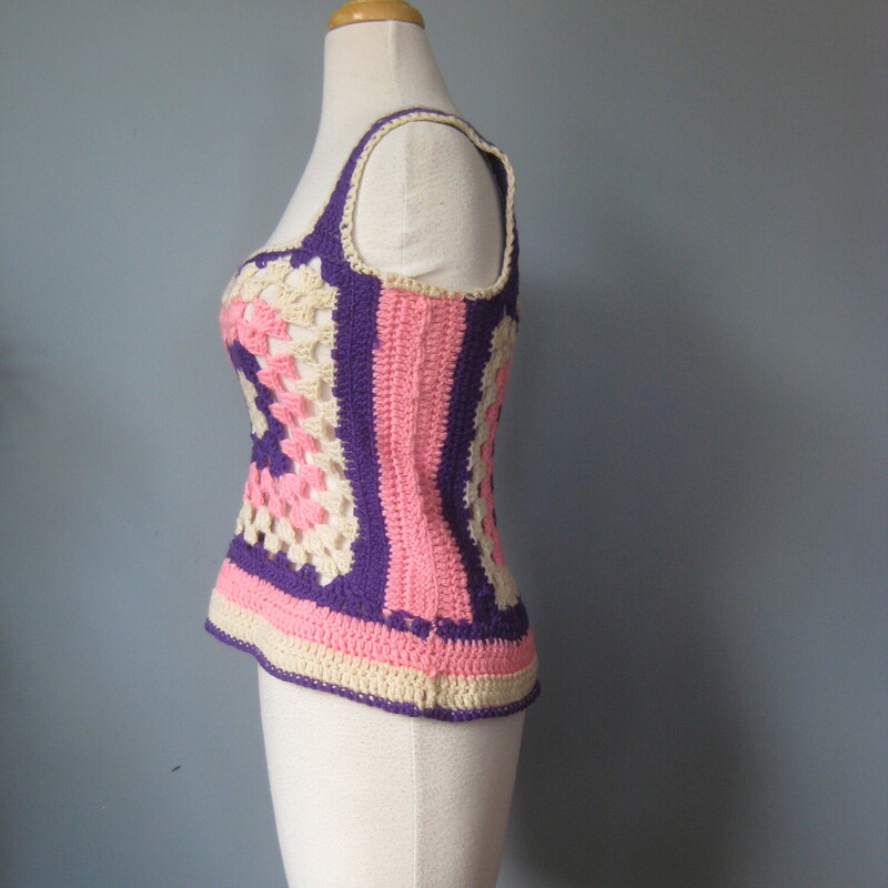 Crochet Tank, Pink, Size: Medium\\Super simple hand crocheted granny square cropped top or vest<br />
in pretty pastels, purple, pink and white<br />
armpit to armpit: 16<br />
width at hem: 19<br />
21.5length: 19<br />
It's stretchy because of the construction, probably handmade with acrylic yarn<br />
This vest is unlined so you will need something underneath<br />
No tags<br />
<br />
thanks for looking!<br />
#77118