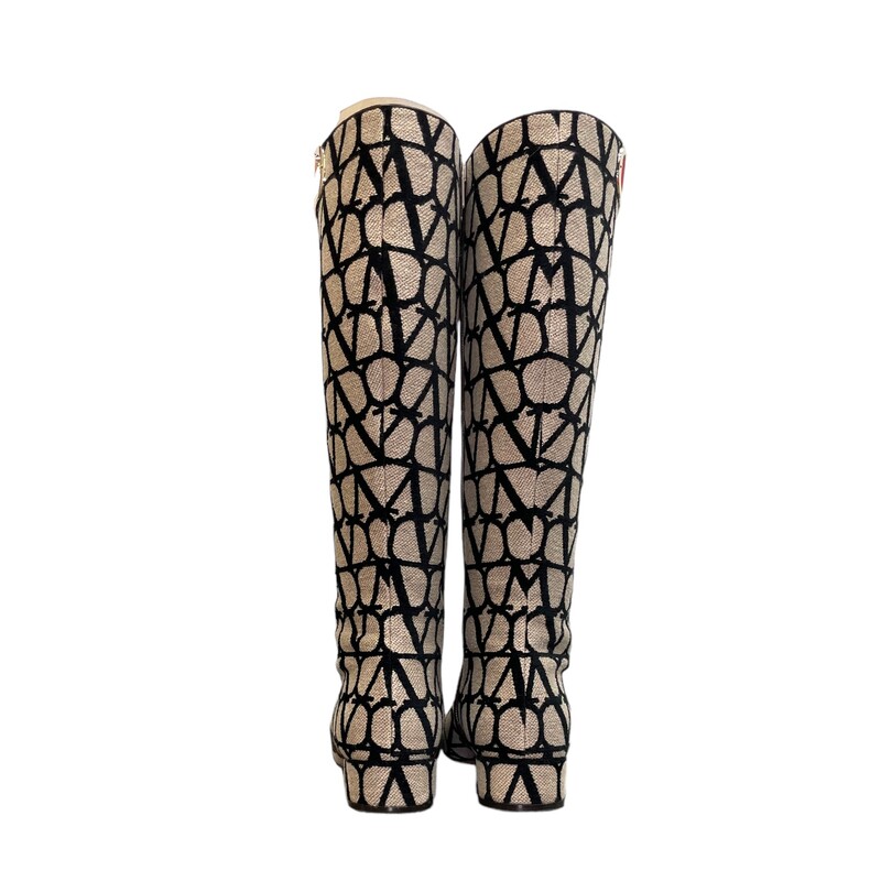 Valentino Garavani Toile Iconographe Vlogo Knee High Boots<br />
Womens Size 39<br />
Cut-out leg decorated with VLogo Type accessory in platinum finish<br />
Side zipper closure<br />
Heel height: 30 mm / 1.2''<br />
Boot shaft height: 39 cm / 15.4''<br />
Made in Italy<br />
<br />
Comes with the original box