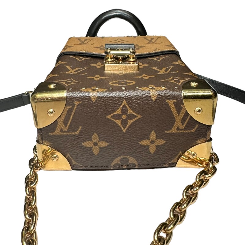 Louis Vuitton Camera Box Chain Bag<br />
Date Code: Microchip<br />
Monogram and Monogram Reverse coated canvas<br />
Cowhide-leather trim<br />
Microfiber lining<br />
Gold-color hardware<br />
Flap closure with S-lock<br />
Inside back flat pocket<br />
Strap:Removable, adjustable<br />
Strap drop:19.3 inches<br />
4.9 x 6.9 x 2.4 inches<br />
(length x Height x Width)<br />
* Some minor stratches on hardware<br />
*Comes with box and dust bag