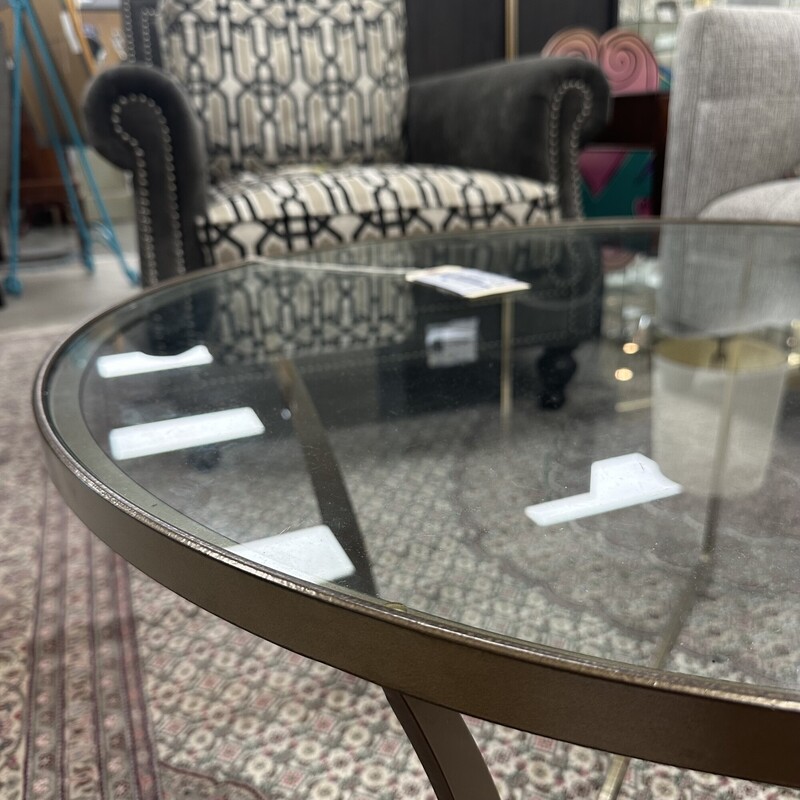 Circle Furniture Round Glass Coffee Table, retails for $1,740! Heavy metal base with round glass top.<br />
Size: 36in W