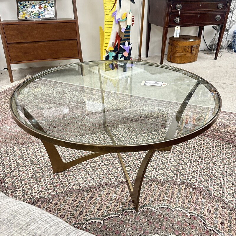 Circle Furniture Round Glass Coffee Table, retails for $1,740! Heavy metal base with round glass top.<br />
Size: 36in W