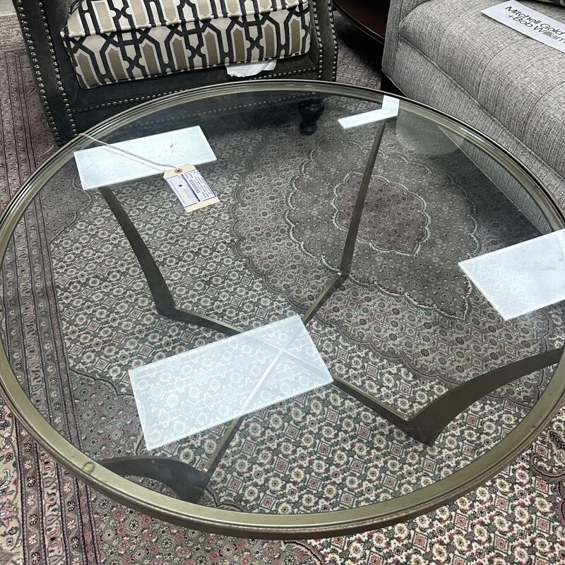 Circle Furniture Round Glass Coffee Table, retails for $1,740! Heavy metal base with round glass top.<br />
Size: 36in W