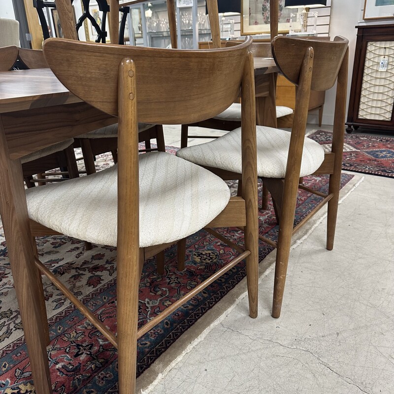 Mid Century Modern Dining Chairs, sold as a set of 8. Brown Frame with reupholstered seats. In great shape for their vintage age.