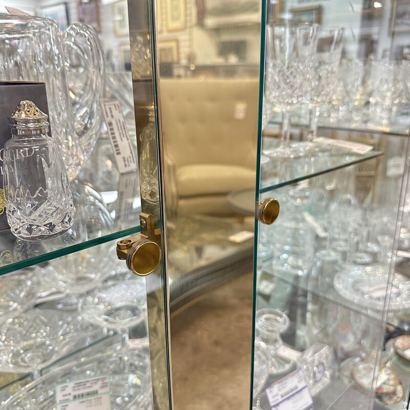 Mid Century Modern/Art Deco Ello Brass Display Case, Brass. Huge! Glass doors, glass shelves. We have two of these while supplies last.<br />
Size: 82x38x21