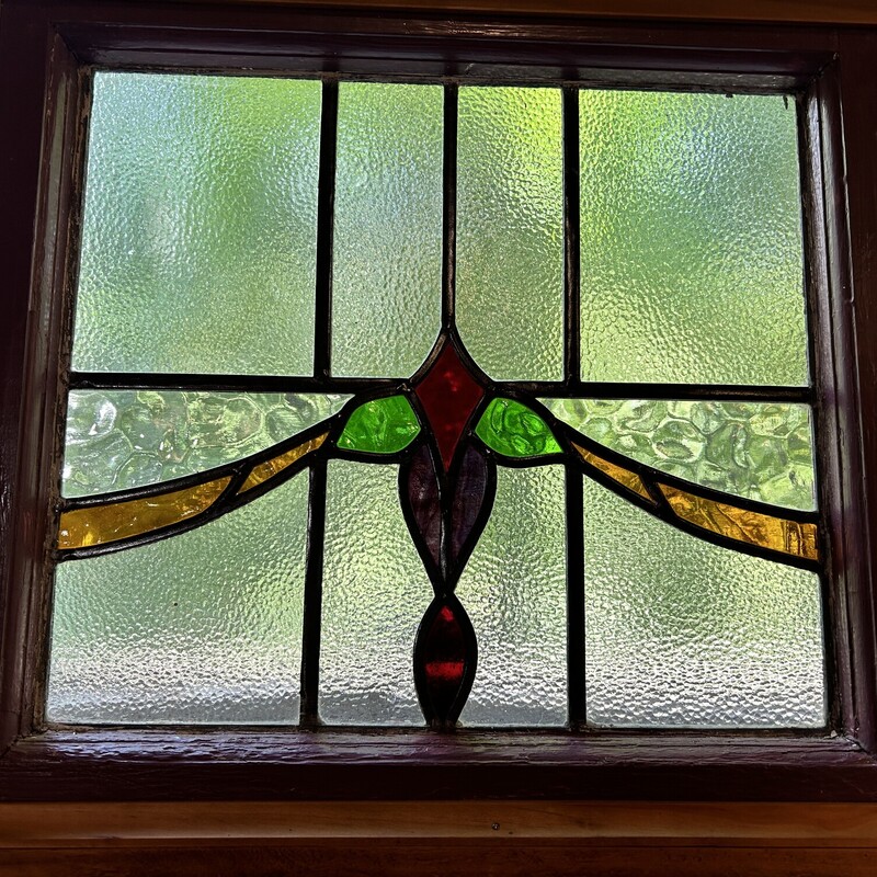 Triple Stain Glass Wndw,
 Size: 62x4x20
This is a beautiful example from the craftsman era.  It is three panes that have been framed so they are one piece.  it comes with large eyescrews for ease of hanging.