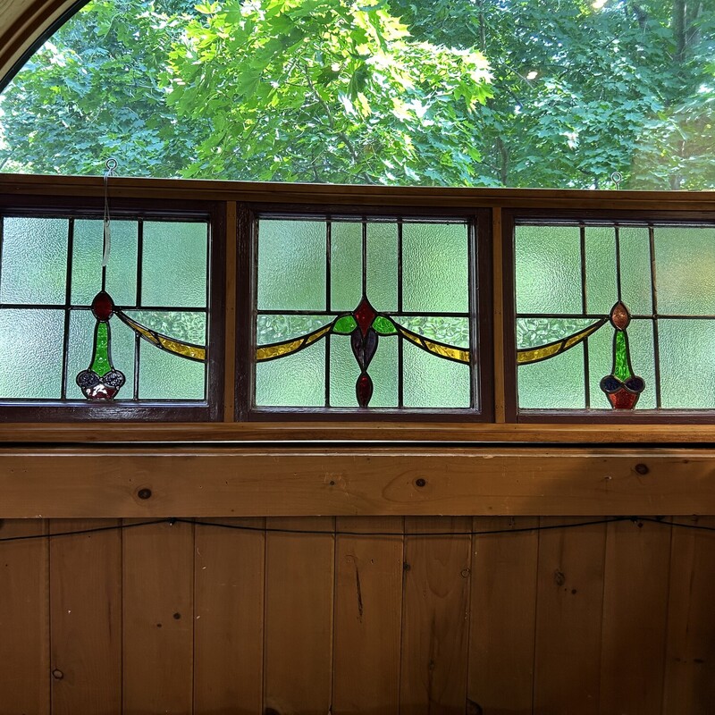 Triple Stain Glass Wndw,
 Size: 62x4x20
This is a beautiful example from the craftsman era.  It is three panes that have been framed so they are one piece.  it comes with large eyescrews for ease of hanging.