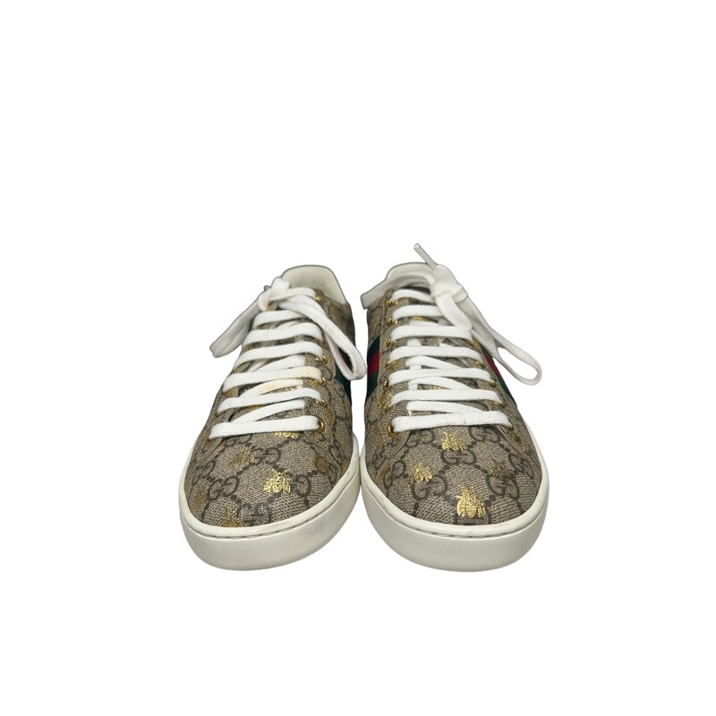 Gucci Bee Supreme Sneakers<br />
Beige/ebony GG Supreme canvas with gold bees print<br />
Green and red Web detail<br />
.8 height<br />
Made in Italy