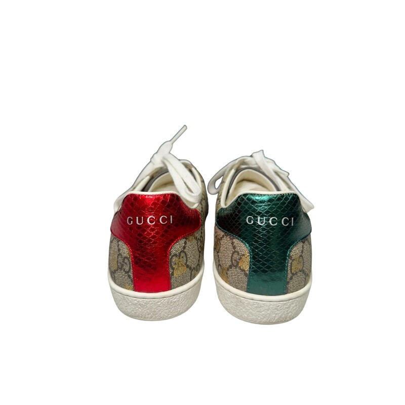 Gucci Bee Supreme Sneakers<br />
Beige/ebony GG Supreme canvas with gold bees print<br />
Green and red Web detail<br />
.8 height<br />
Made in Italy