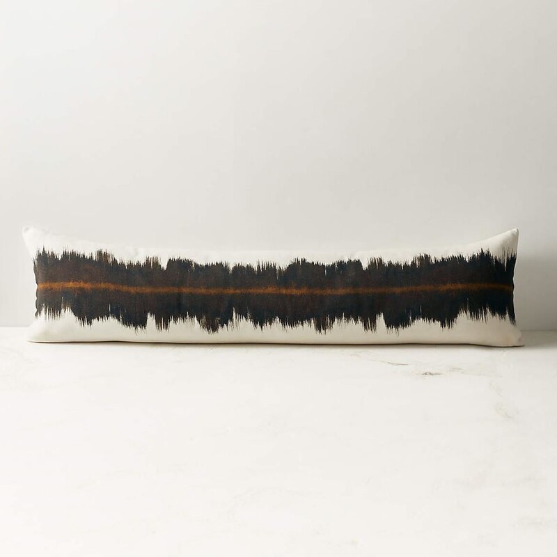 CB2 Vesper Linen Lumbar Pillow
Tan Black Brown Size: 47 x 12.5H
Retails: $99.95

Linen throw pillow by Sarah Von Dreele wears a static pattern of rich brown tones and a bold ocher accent line, with a complementary solid self back. CB2 pillows include a pillow insert in your choice of feather down or down alternative. CB2 exclusive.

Vesper Brown and Tobacco Linen Lumbar Pillow with Down-Alternative Insert
Designed by Sarah Von Dreele
100% linen
Solid self back
Feather-down insert: 95% white duck feather, 5% white feather-down fill (made in Thailand) -Down-alternative insert: 100% polyester fill (imported)
Inset zipper
Dry-clean only
Low iron
Do not bleach
Made in India