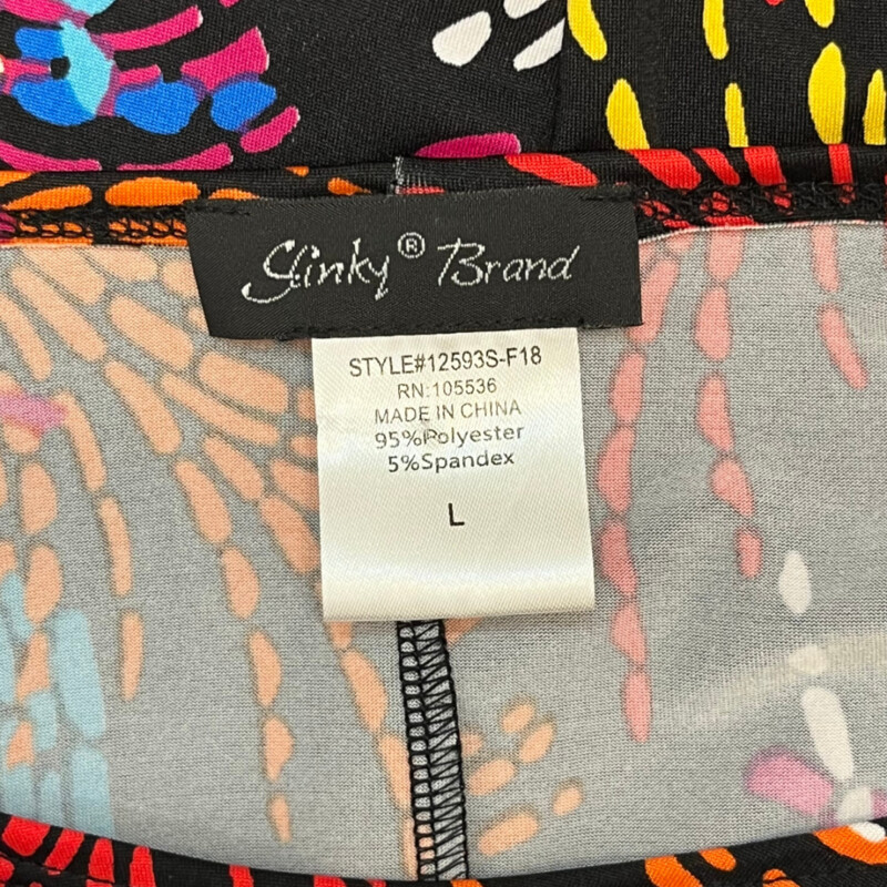 Slinky Brand Tunic<br />
Bell Sleeves<br />
Abstarct Burst Pattern<br />
Black with a Rainbow of Colors<br />
Size: Large