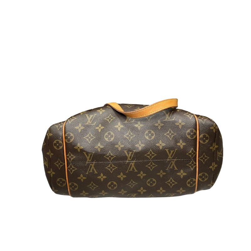 LOUIS VUITTON Monogram Totally PM. This stylish tote is crafted of Louis Vuitton monogram coated canvas. The bag features patch pockets on either side and vachetta cowhide leather trim and shoulder straps, with polished brass hardware. The top zipper opens the bag to a cocoa brown fabric interior with patch pockets.<br />
Dimensions:<br />
Length: 11 in<br />
Height: 9.5 in<br />
Width: 5.5 in<br />
Drop: 9.75 in<br />
Code :SD1103<br />
<br />
Water marking on strap shown in photos