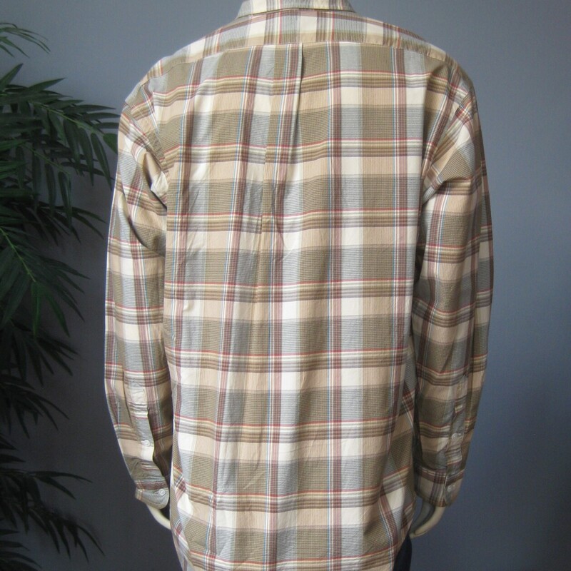 Nice mens long sleeved shirt by<br />
Ralph Lauren<br />
100% Cotton, lightweight poplin woven<br />
soft green, tan and cream plaid<br />
curved hem makes it easy to tuck in<br />
made in Mauritius<br />
Size Large<br />
flat measurements:<br />
shoulder to shoulder: 22.5<br />
armpit to armpit: 26.5<br />
underarm sleeve seam length: 22<br />
Length: 33<br />
<br />
excellent condition, no flaws<br />
thanks for looking!<br />
#76066