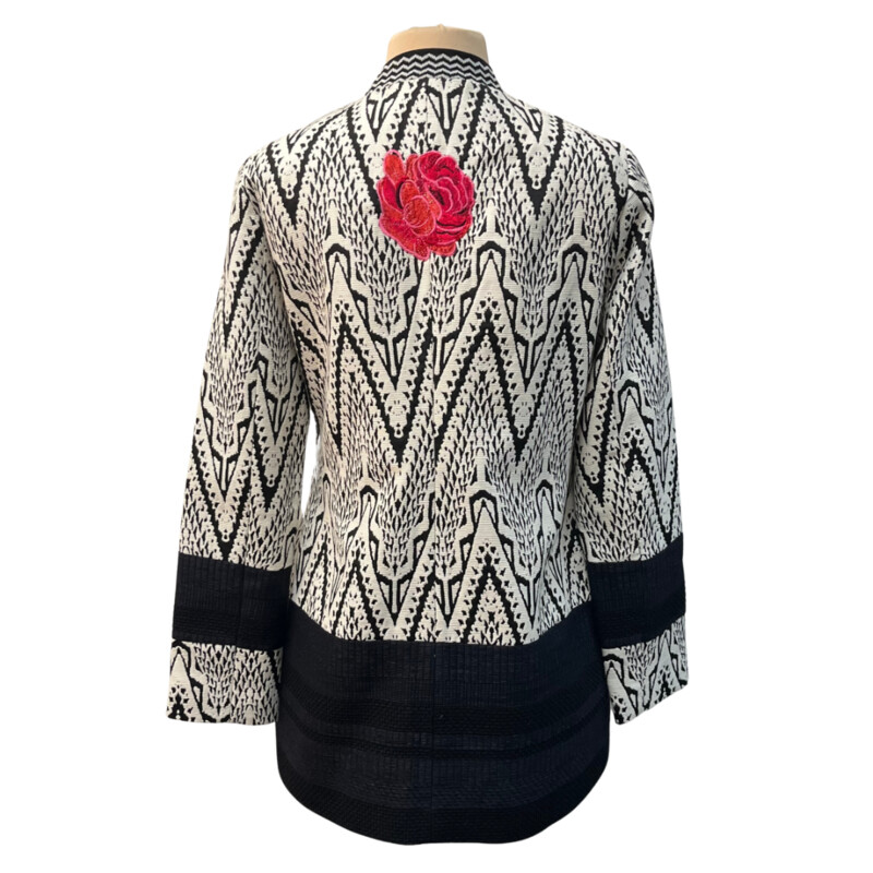 Desigual Woven Jacket<br />
Absolutely Stunning!<br />
Embroidered Floral Detail<br />
Arm Banding Detail<br />
Embroidered Flower On Back<br />
Lined with Floral Lining<br />
No Detail Missed on This One!<br />
Black and White with a rainbow of Colors<br />
Size: 10