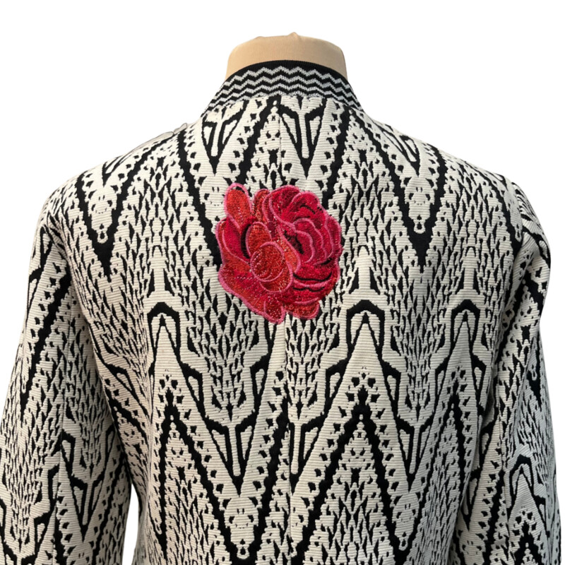 Desigual Woven Jacket<br />
Absolutely Stunning!<br />
Embroidered Floral Detail<br />
Arm Banding Detail<br />
Embroidered Flower On Back<br />
Lined with Floral Lining<br />
No Detail Missed on This One!<br />
Black and White with a rainbow of Colors<br />
Size: 10