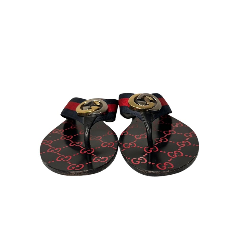 Gucci Kika Webb
Red
Size: 37
Gucci sandals in leather and green/red/green Web.
Flat heel.
Thong strap with interlocking two-tone GG center.
Slide style.
GG supreme-print footbed.
Smooth outsole.

Box Included