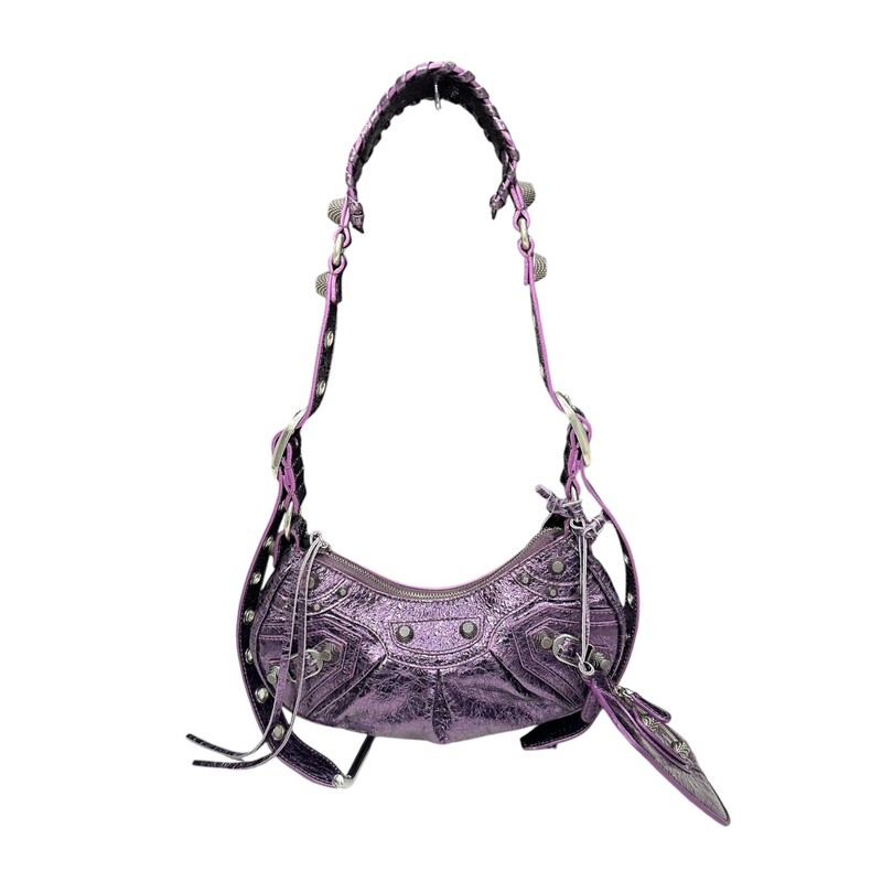 BALENCIAGA Metallic Agneau Arena Le Cagole

Shoulder Bag XS in Met Mauve. This stylish and structured handbag is crafted of metallic leather in purple calfskin leather. The bag features an adjustable shoulder strap, a coin purse, a heart shaped mirror, and signature silver studs and faux buckles. The top unzips to a black fabric compact interior.

Code:571309 5214 0 640167

Dimensions:
Length: 10 in
Height: 5.5 in
Width: 2.5 in

Drop: 19.5 in