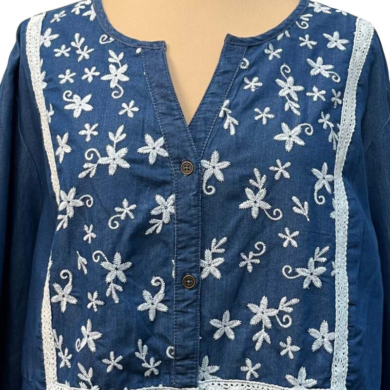 Woman Within Blouse<br />
Lace Trim<br />
Denim with White Embroidered Flowers<br />
Cute gather in the back<br />
Elastic cuff sleeve<br />
100% Cotton<br />
Size: 22/24